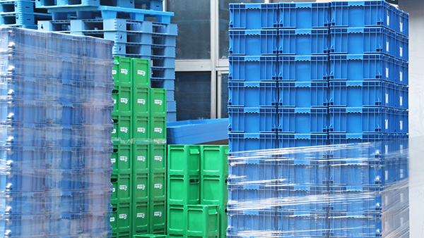 Blue and green containers pictured in the precision-parts project archive